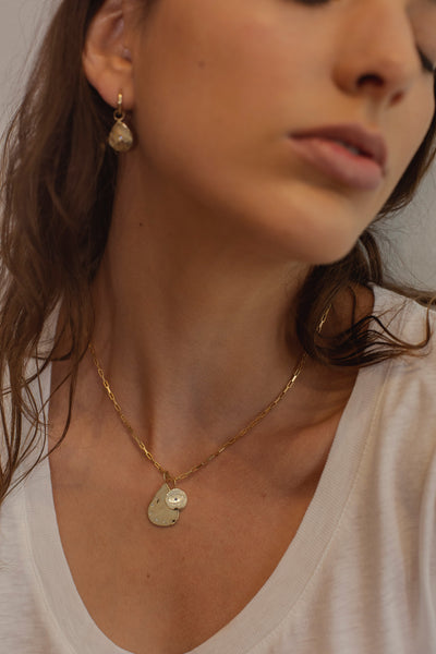 ali grace jewelry handmade in nyc sustainable jewelry gold custom charm evil eye necklace cool girl fine jewelry