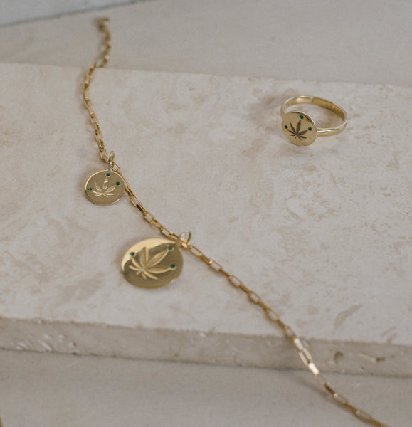 ali grace jewelry sustainable jewelry design cannabis weed leaf ring gold emerald fine jewelry rich stoner jewelry