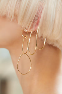 ali grace jewelry sustainable jewelry design handmade in nyc gold statement hoop earrings layered earrings model nora vai apm models nyc