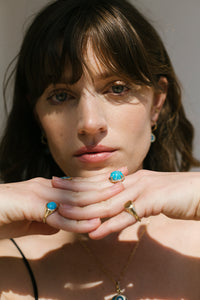 ali grace jewelry sustainable ethical fashion charm necklace fine jewelry turquoise charm necklace cocktail ring model fashion photography nyc