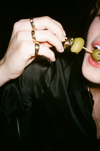 ali grace jewelry ali grace cheesecake sel rrose new york city handmade jewelry nyc sustainable fashion ethical design turquoise pinky signet ring peridot bubble ring cocktail party jewelry stacked pinky rings martini olives 35mm fashion photography